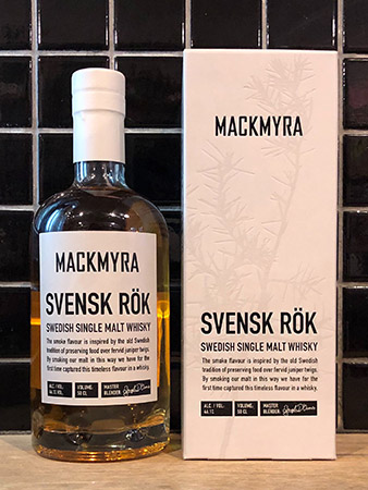 A bottle of Mackmyra single malt whiskey next to its display box